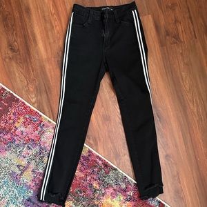 Black jeans with white stripes
